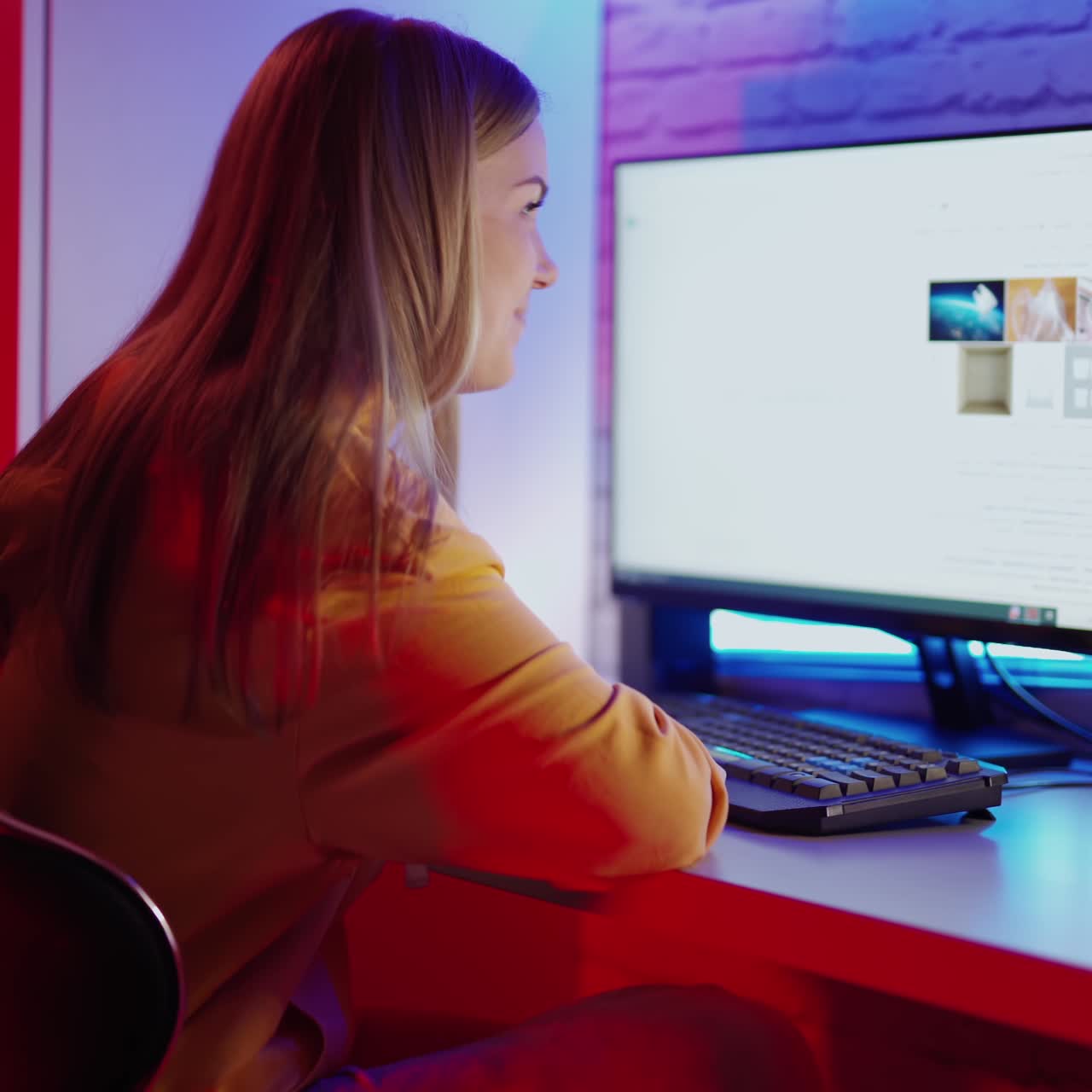 Girl using computer in room