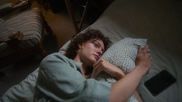 Woman Sleeping in Bed