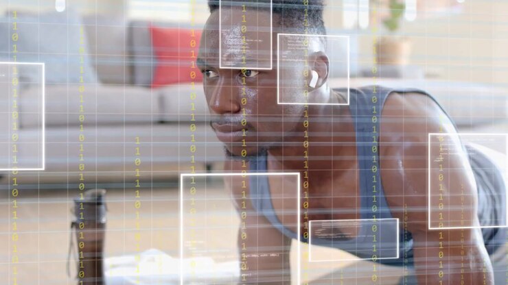 Vertical video: Man following audio cue, holding forearm plank on black mat, fitness UI overlaying