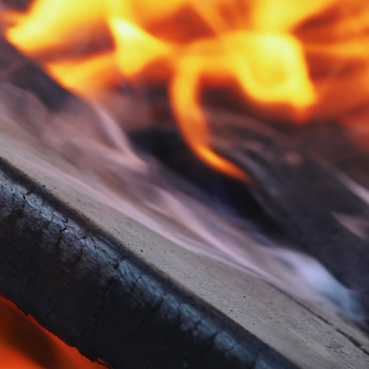 Burning fire. Bright burning wood slow motion. Splashes of flame and live coals.