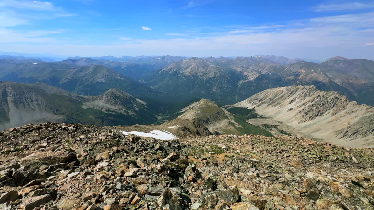 Summer Independence Pass hiking trail La Plata Peak Sawatch Range Rocky Mountains top of summit 14er Colorado aerial drone Mt Elbert Collegiate Peaks switchback blue sky clouds haze pan left motion