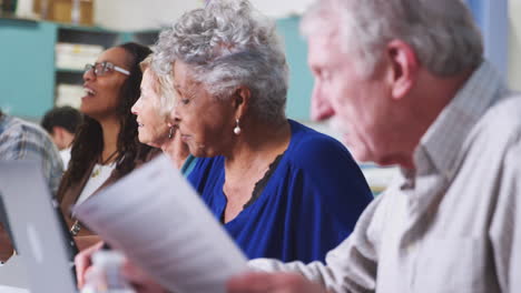 Group-Of-Retired-Seniors-Attending-IT-Class-In-Community-Centre