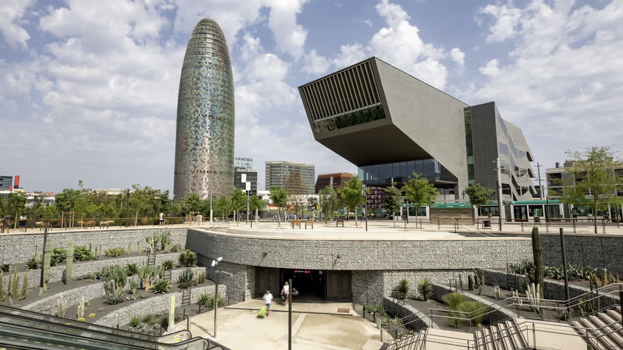 Timelapse of Glories Metro Station In Barcelona and skyline