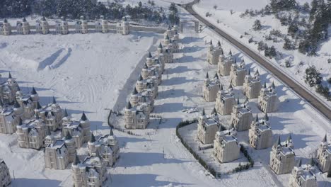 aerial view of burj al babas abandoned castles in snowy turkey