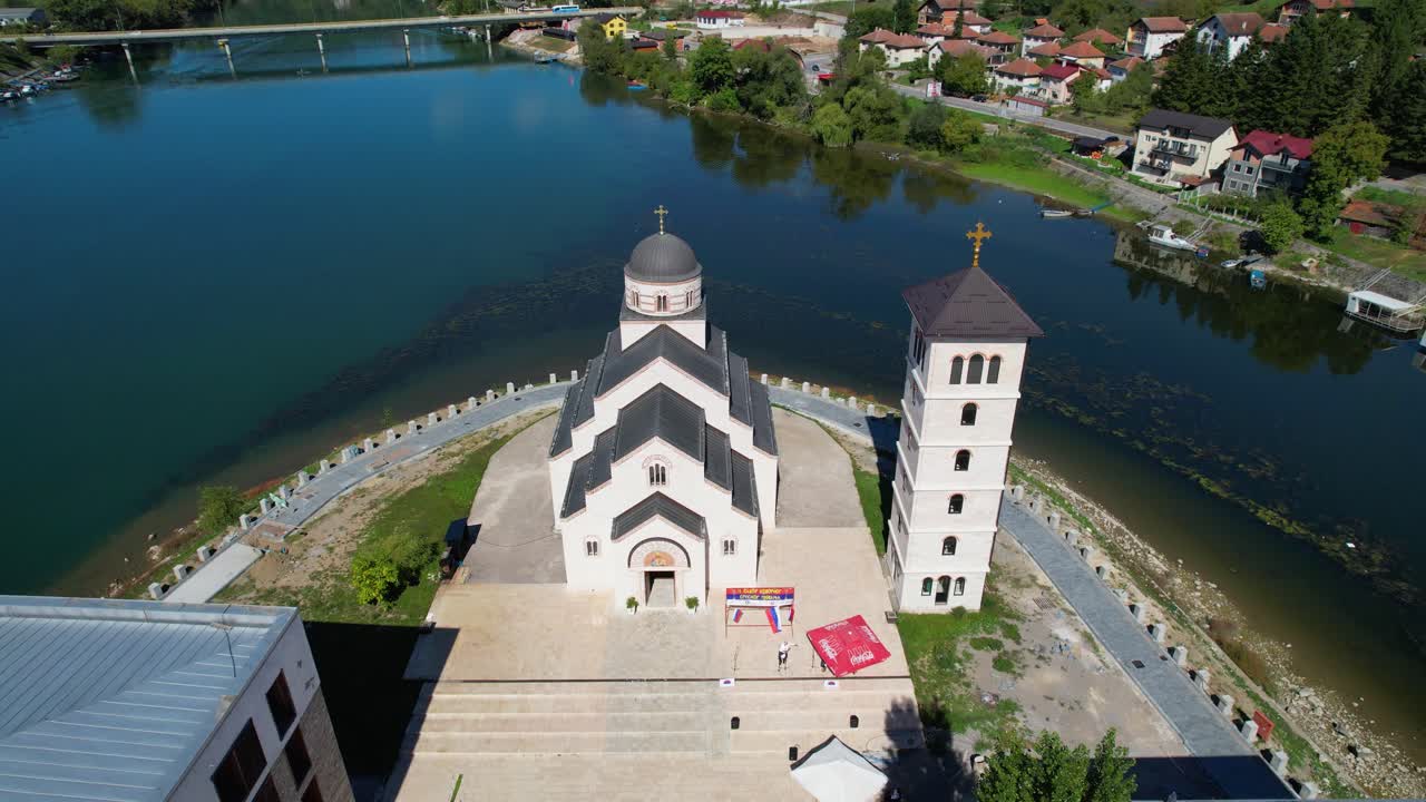 Aerial view of Andricgrad in Visegrad, Bosnia and Herzegovina with riverside architecture, central church, buildings, modern structures, and scenic urban layout blending history and culture