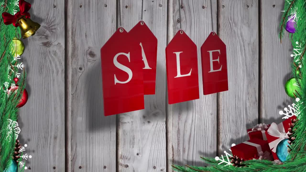 animación del texto de venta en etiquetas de navidad rojas sobre fondo de madera