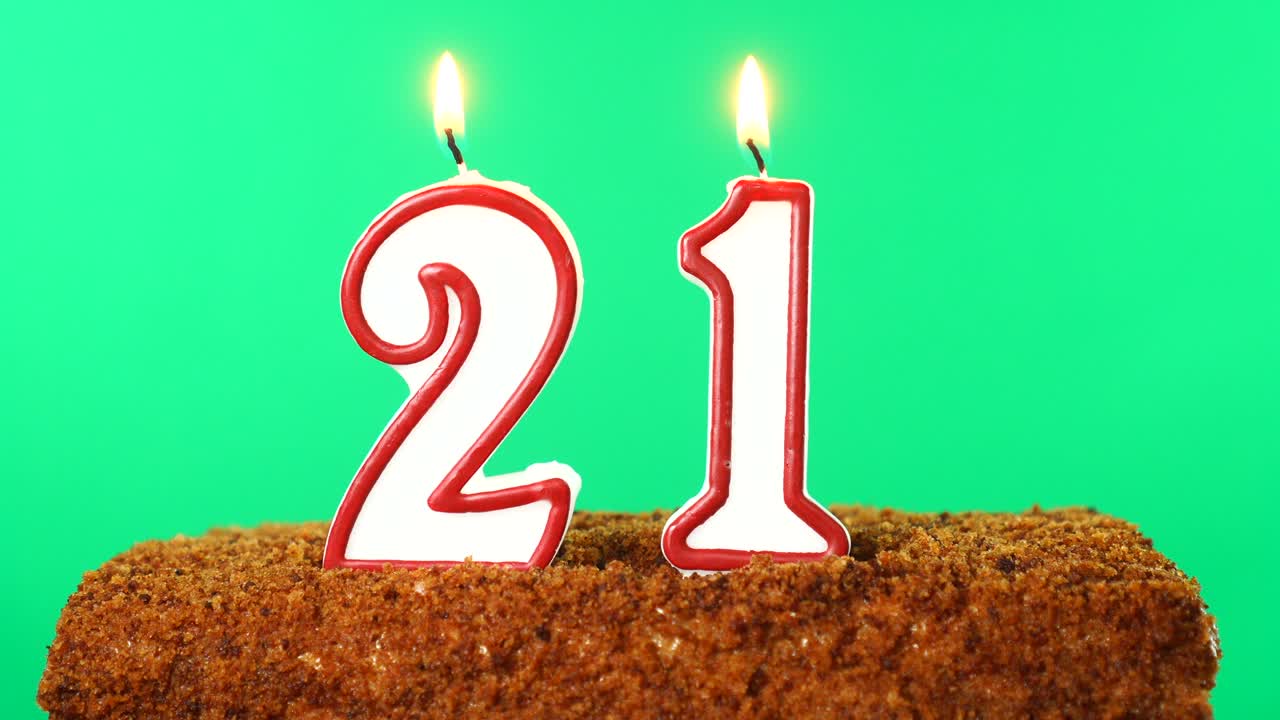 Cake with the number 21 lighted candle. Chroma key. Green Screen. Isolated