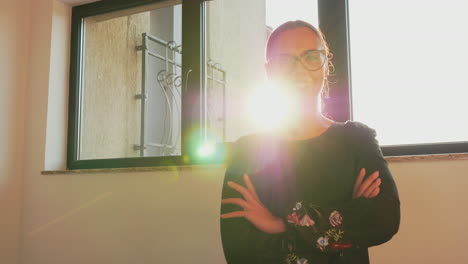 Businesswoman-looking-at-camera-standing-on-stairs