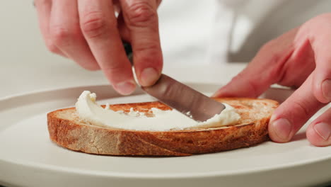 preparing a creamy cheese toast