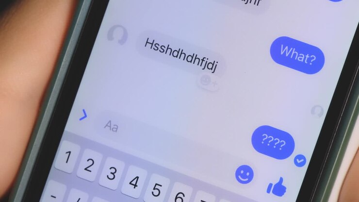 Crazy girl messaging with a boy from a phone. Relationships problems. Annoyed situation. Close up