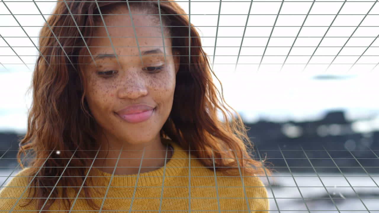 animación de estrellas brillantes sobre la red contra una mujer afroamericana que usa un teléfono inteligente