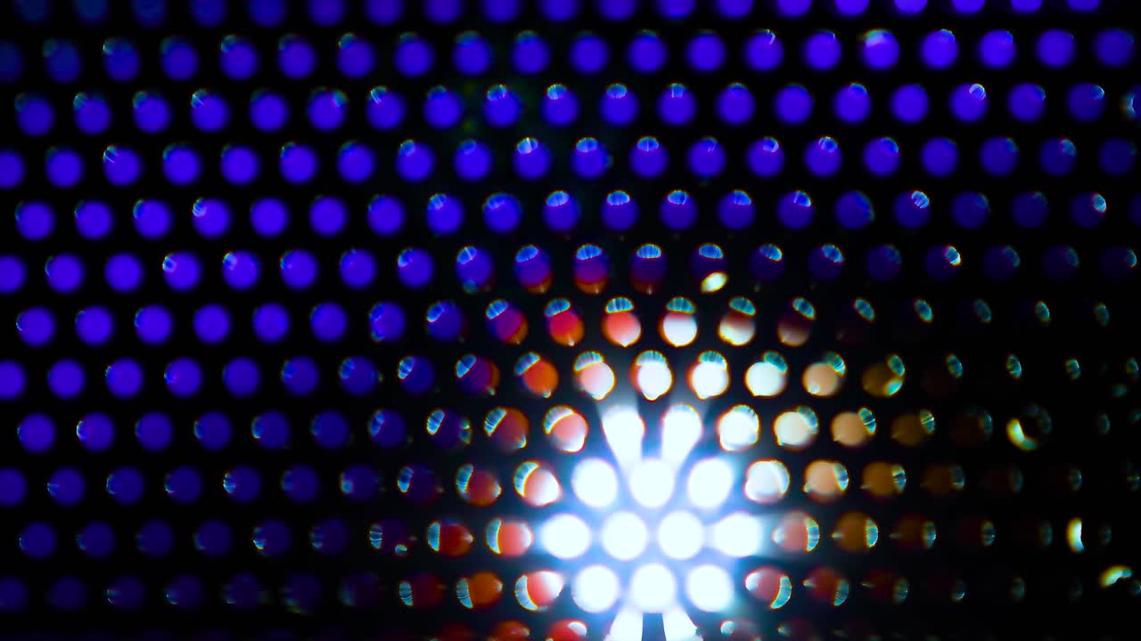 fondo de bucle colorido con agujeros que brillan intensamente de diferentes luces en movimiento, papel tapiz digital para el escenario