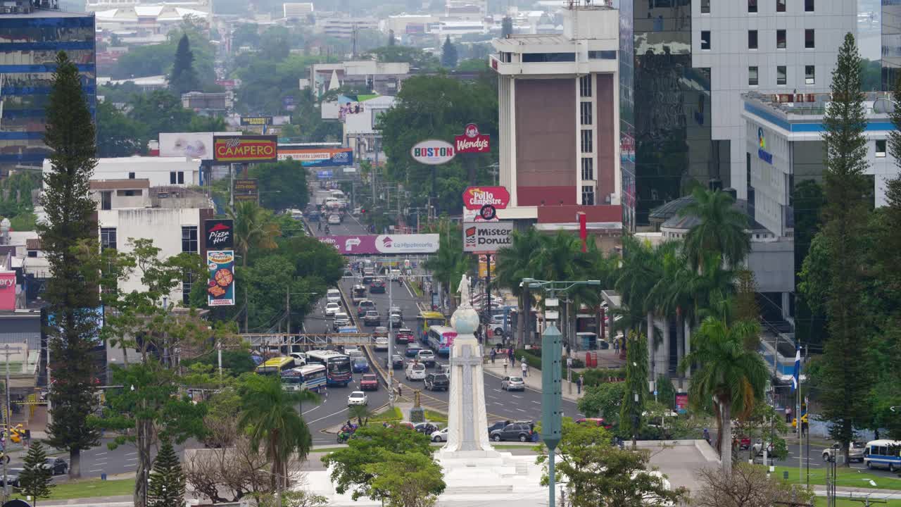 Traffic in the downtown area of the city of San Salvador, El Salvador in front of the monument of The Divine Savior of The World.