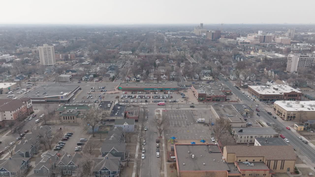 Aerial footage showing homes and small businesses in a Minneapolis residential district.