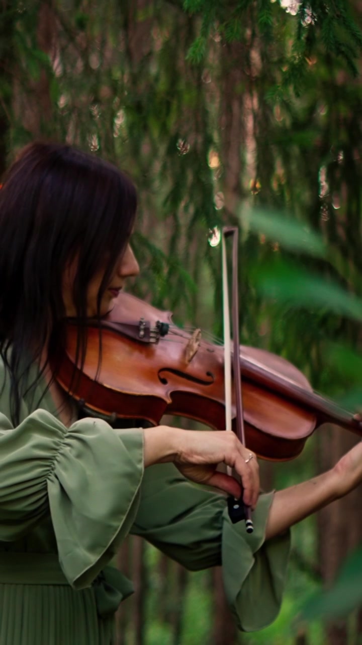 Woman Playing Violin in a Serene Forest Setting