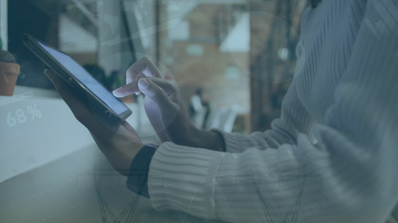 Animation of data processing over biracial businesswoman using tablet in office