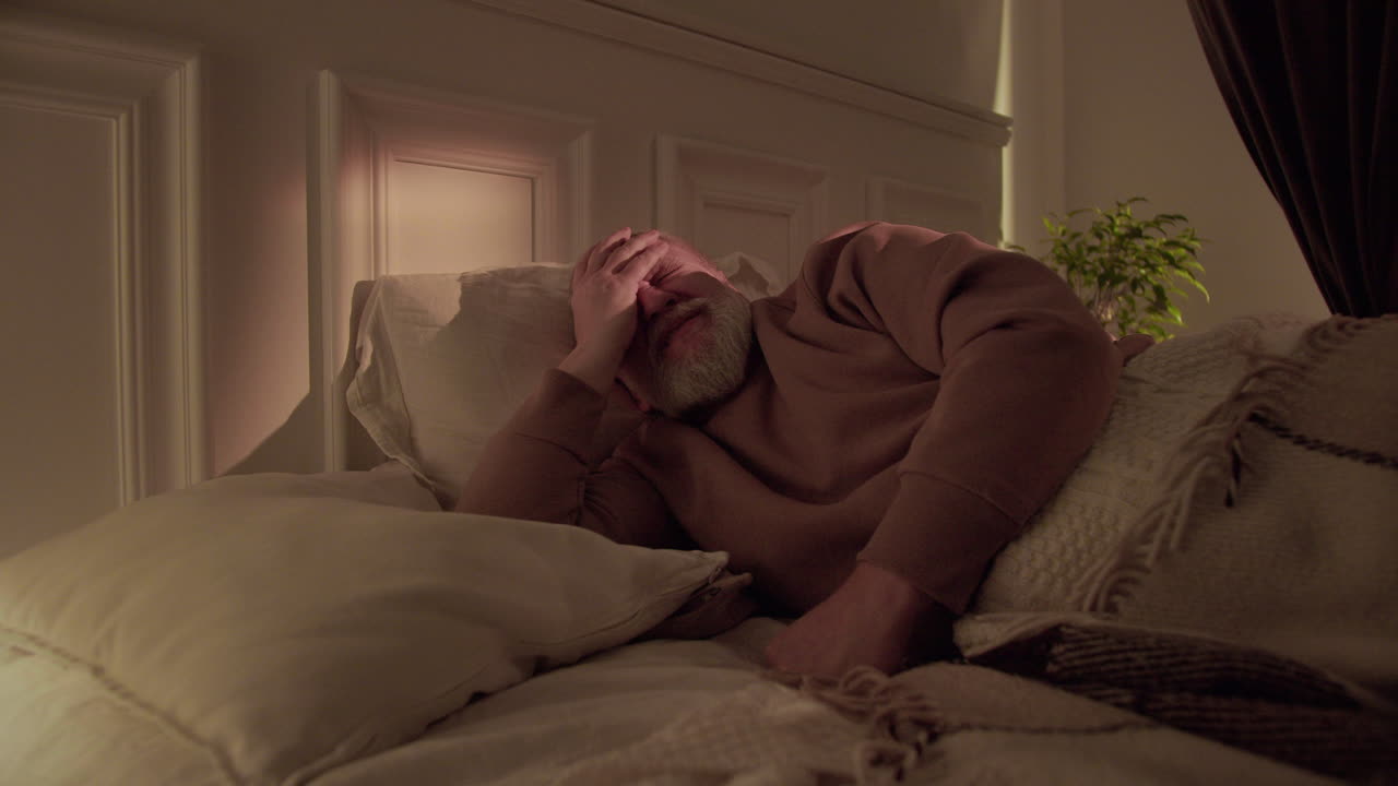 Old man trying to sleep