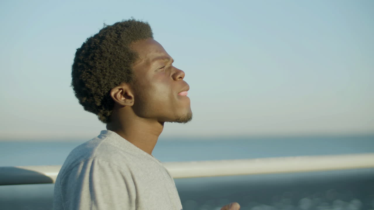 Medium Closeup Shot Of Young Man Having Takeaway Coffee Outside