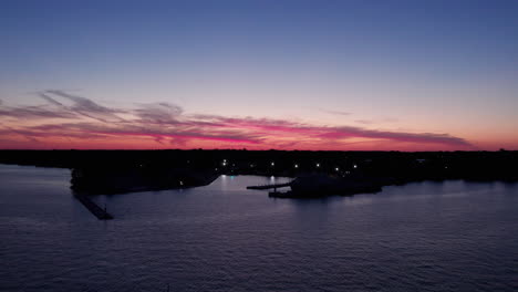 lights from kingsville harbour during golden hour in ontario, canada