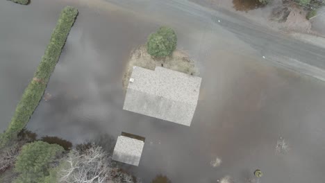 aerial shot of flooded homes, trailers, and streets in quebec neighborhood.