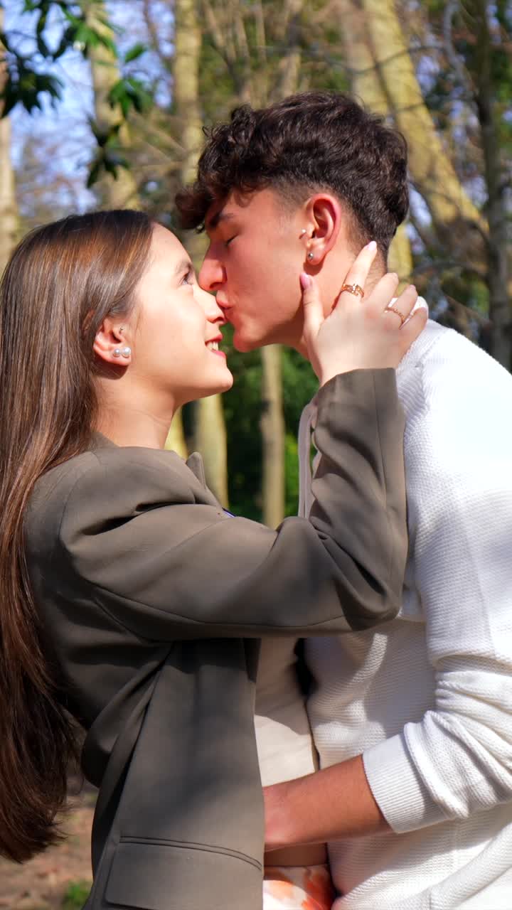 A loving couple embracing in a forest