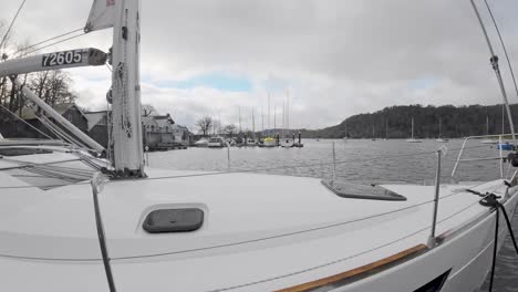 Slow-Motion-Video-Boats,-sailing-ships,-moored-on-the-harbor-of-Bowness-on-Windermere