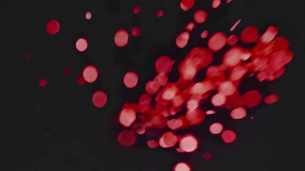 Abstract Red Bokeh Light Particles Floating on Dark Background