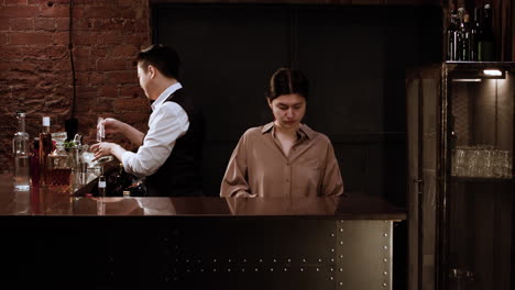 bartenders working in bar