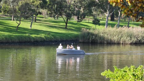 people boating on a calm river