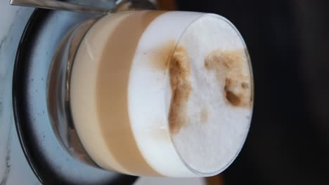 a glass of cappuccino