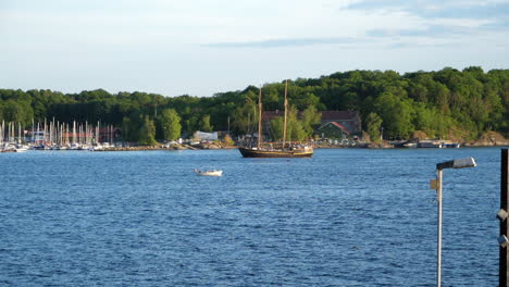 oslo fjord with touristic sailboat cruising tour on a sunny day slomo