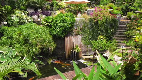 tranquil tropical garden with pond and waterfall