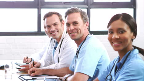 smiling medical team in a meeting
