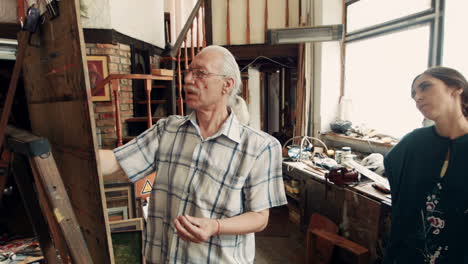art teacher guiding a student in studio
