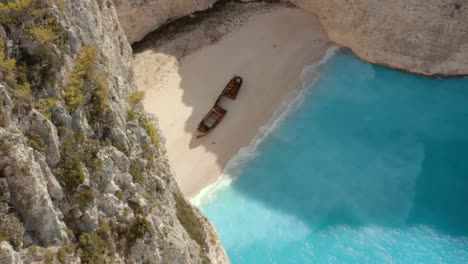 establishing aerial above navagio shipwreck beach in greece, no people