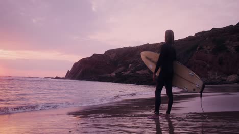 surfer at sunset beach