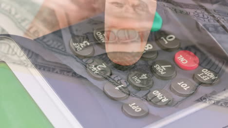 animation of dollar banknotes falling over hand of caucasian man holding payment terminal