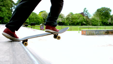 Young-skateboarder-skating-the-outdoor-skatepark