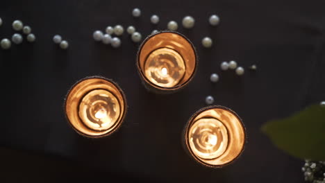 three beautiful candles on a wedding table