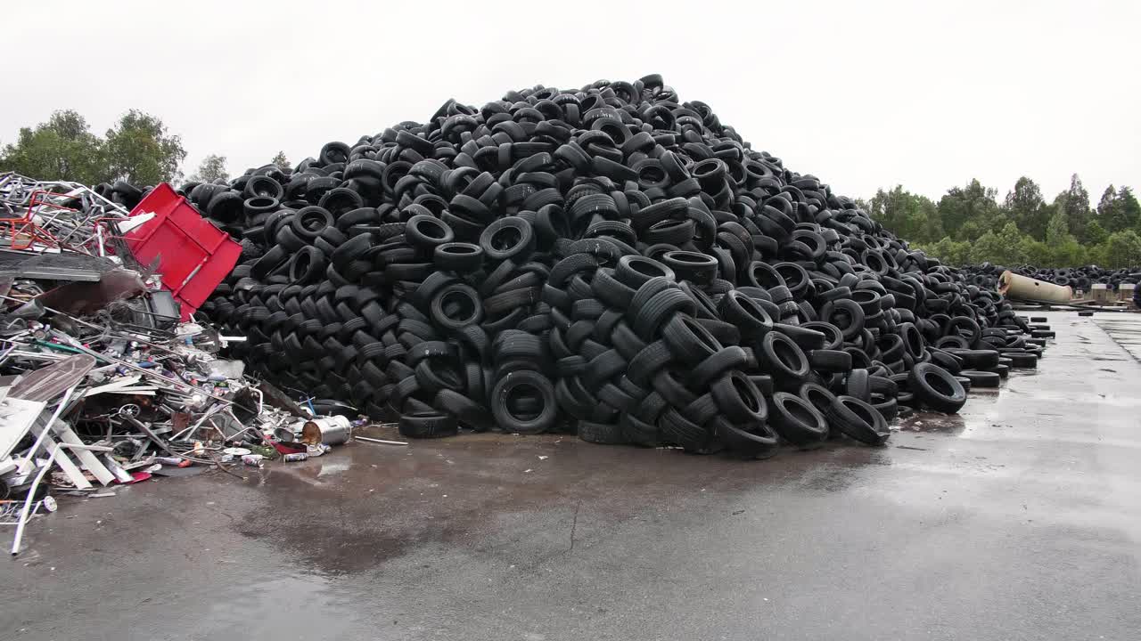 Massive Pile of Used Tires in a Recycling Facility