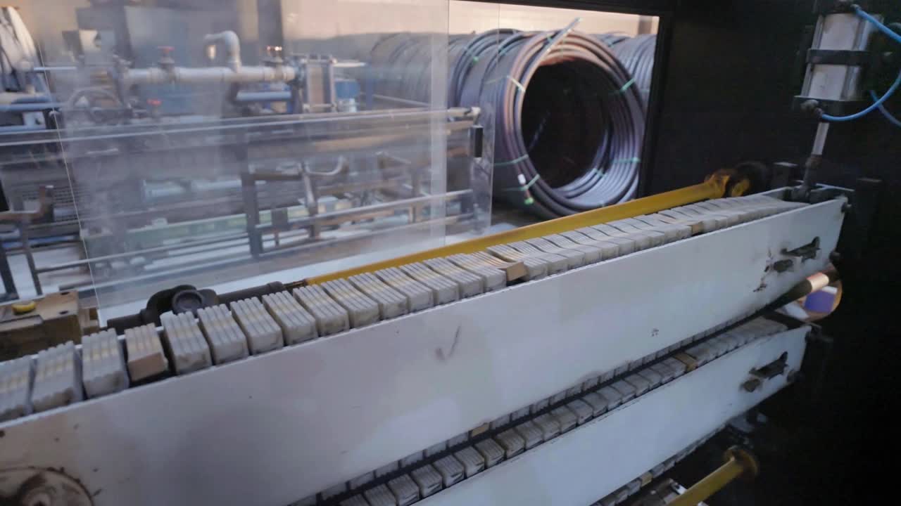 Manufacturing of PVC pipes in factory (polymerizing vinyl chloride)