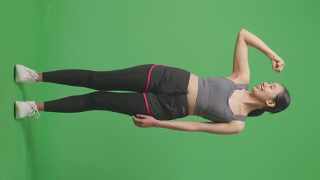 woman posing in sportswear on green screen