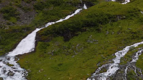 aerial view of a stunning waterfall in a mountainous landscape