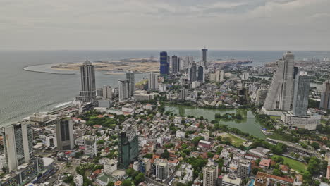 Colombo-Sri-Lanka-Aerial-v17-establishing-drone-flyover-Kollupitiya-capturing-downtown-cityscape-of-the-capital-city,-economic-zones-and-surrounding-neighborhoods---Shot-with-Mavic-3-Cine---April-2023