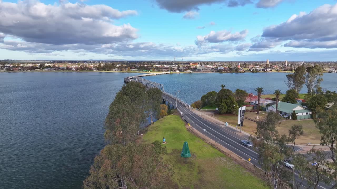 Aerial rise up over the road bridge with the town of Yarrawonga beyond