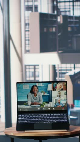 vertical video multiethnic business leaders engaged in a web video conference in office lobby