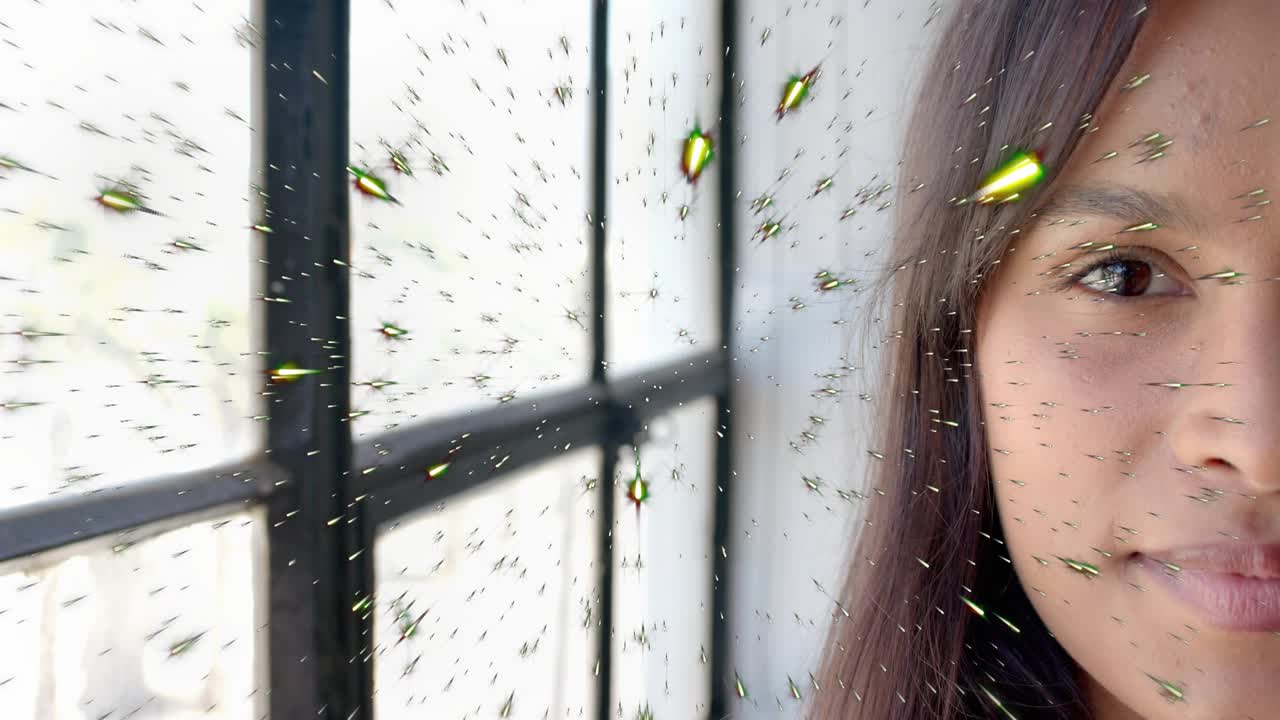 Woman standing by window green flecks appearing growing crossing face causing smile using AR filter