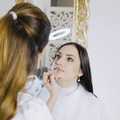 woman painting the lips