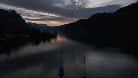 Sunrise-glow-over-Walensee,-Weesen,-Switzerland-aerial-view