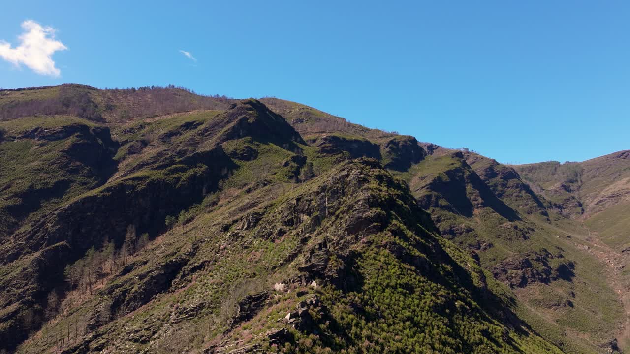 Sheer Mountains With Blue Sky Near Casela, Samos, Spain. Aerial Drone Shot